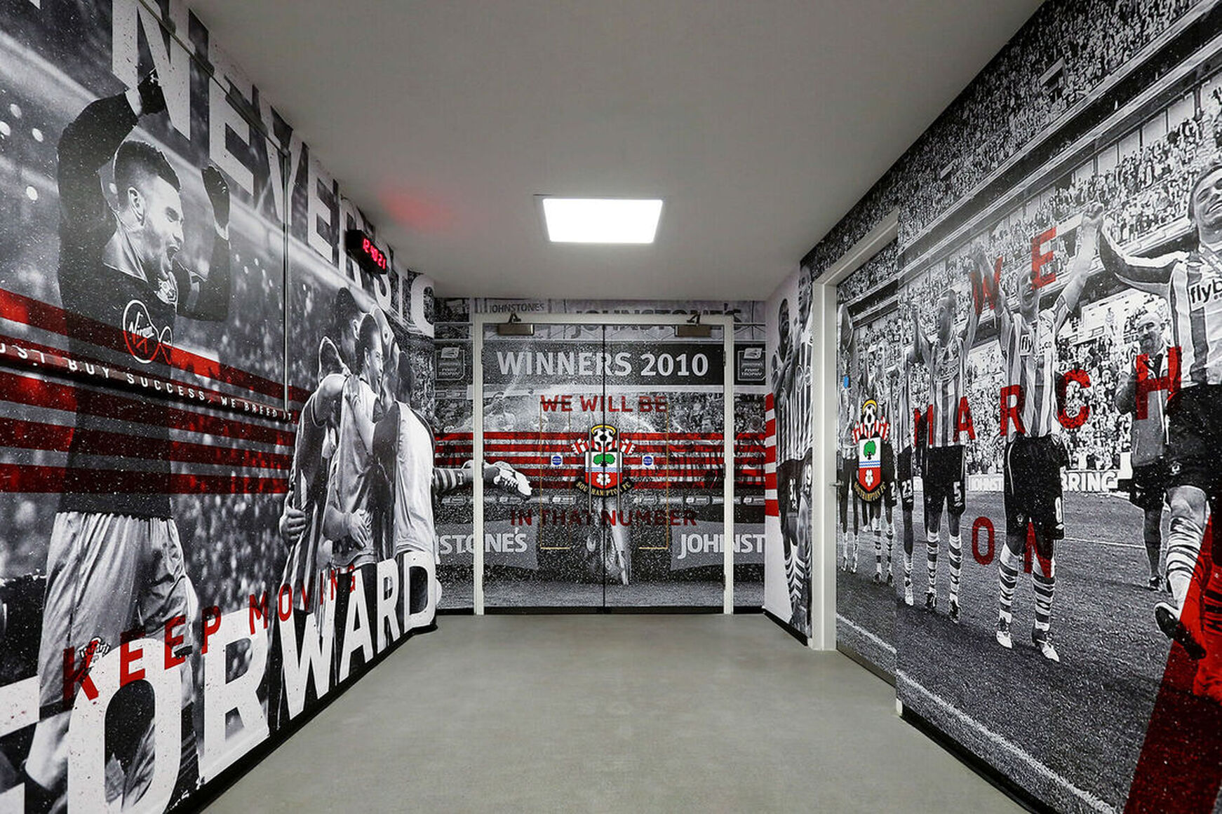 southampton fc artwork on the walls of wembly stadium warm up room