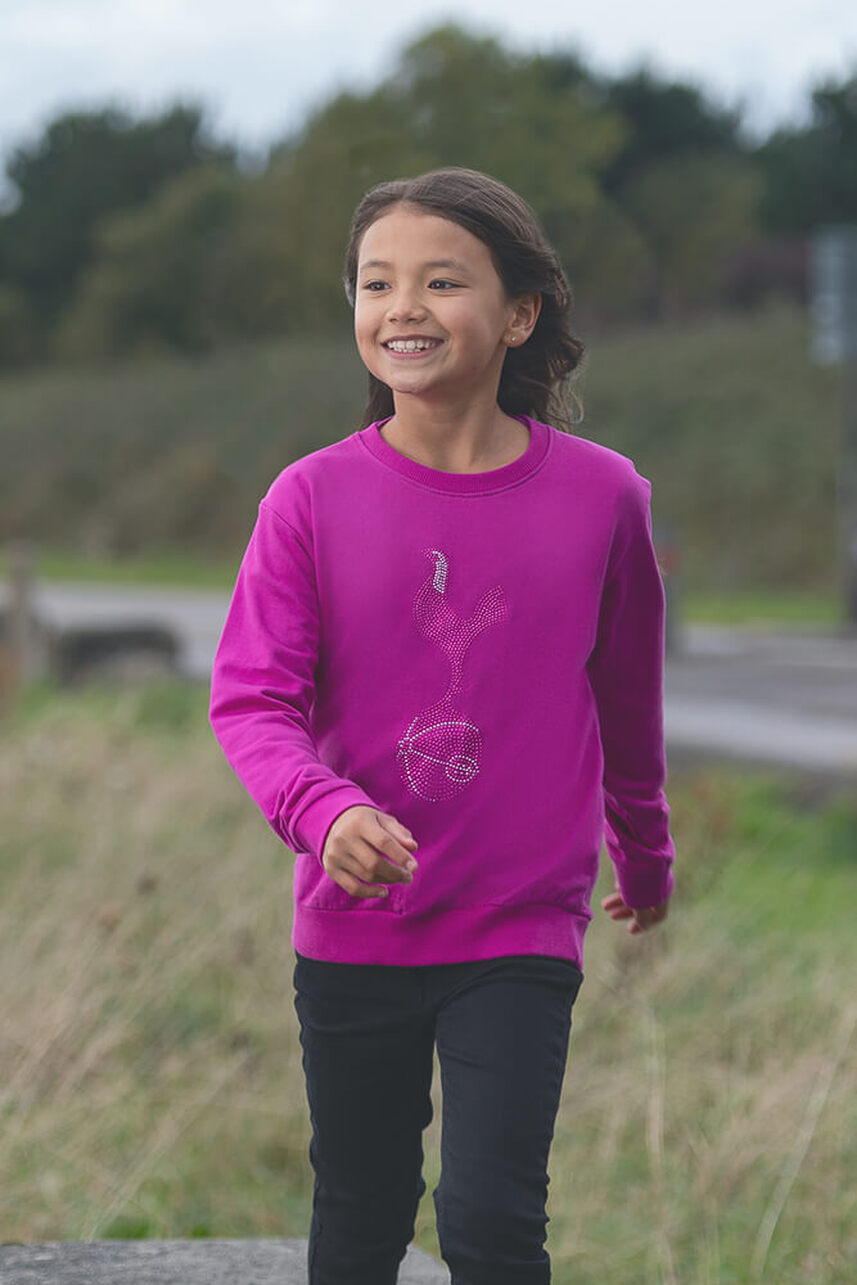 a female child model wearing a pink tottenham hotspur sweatshirtPicture