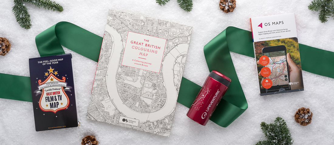 sordnace survey maps photographed froma bove and styled with christmas themed items