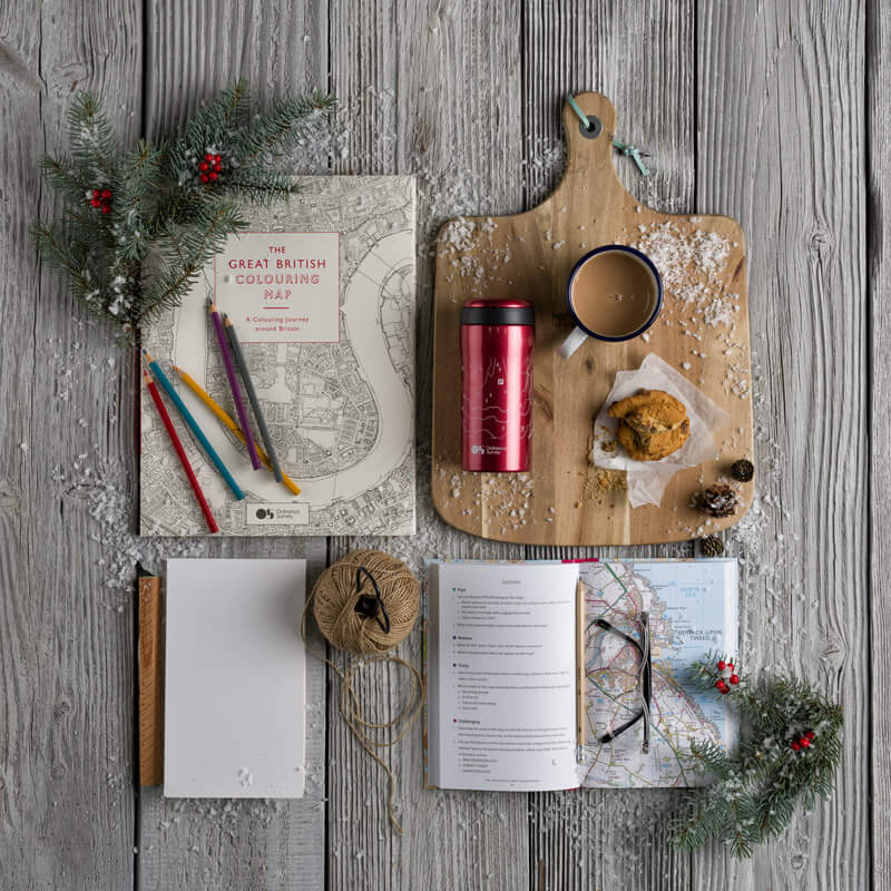 sordnace survey maps photographed froma bove and styled with christmas themed items