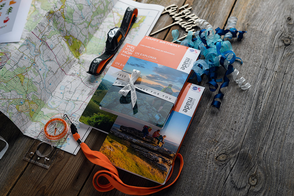 sordnace survey maps photographed froma bove and styled with happy birthday items