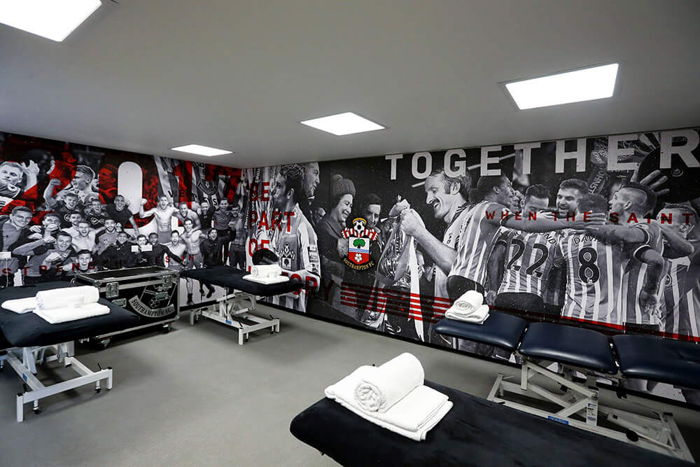 southampton fc artwork on the walls of wembly stadium warm up room